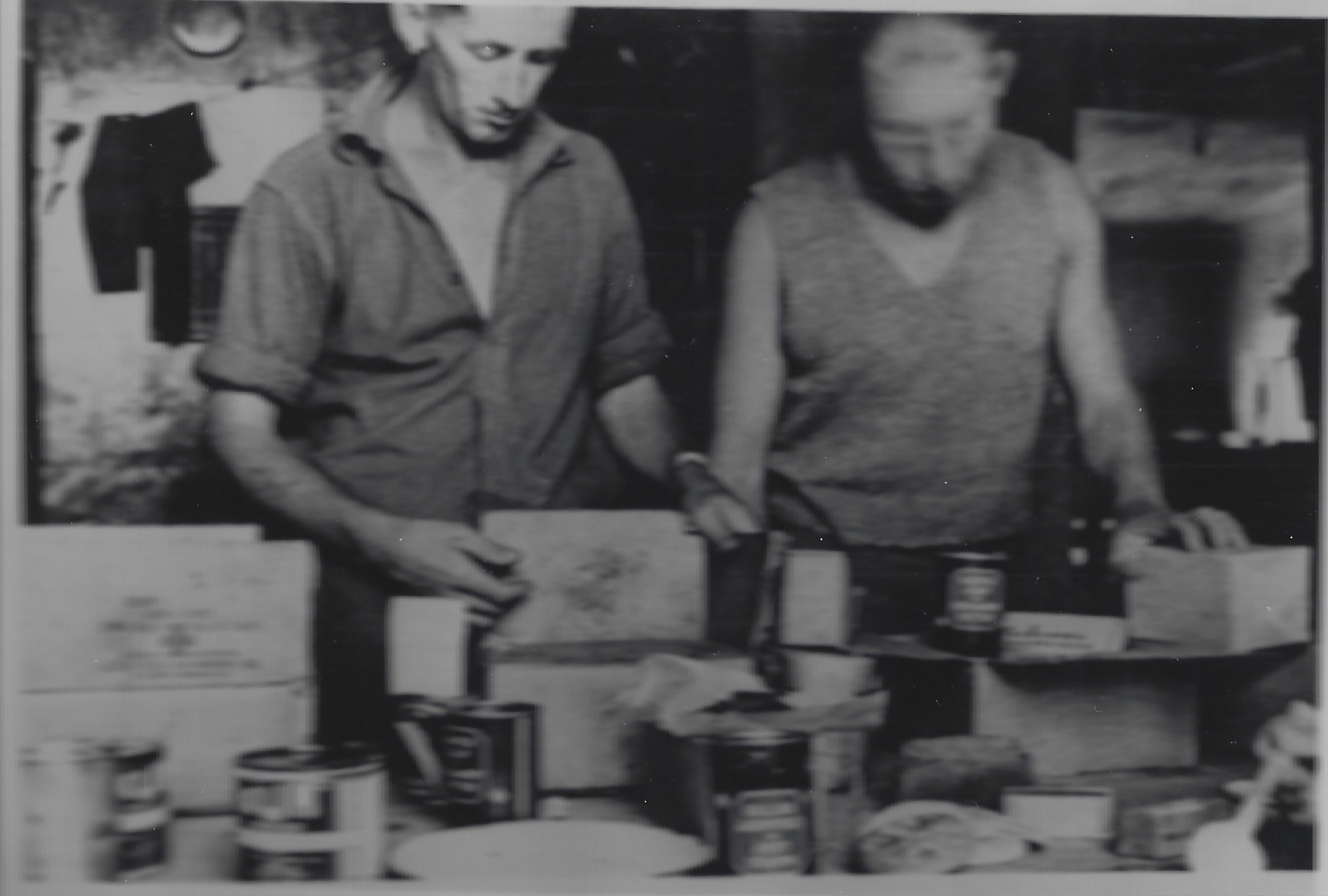 Image of a Prisoner of War inspecting a Red Cross package