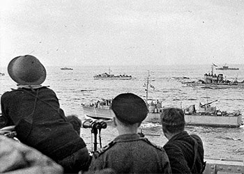 Soldiers watching the landing craft en route to Dieppe.
