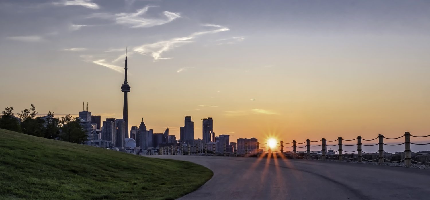 Toronto’s city skyline from Trillium Park showcasing a sunrise