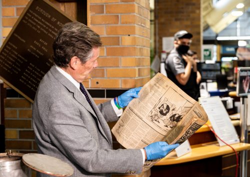 Mayor John Tory reading September 11, 1972 edition of the Sun newspaper