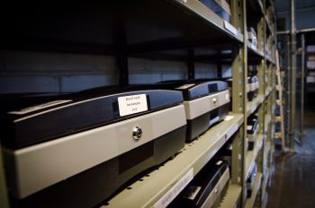 Election machines stacked on shelves