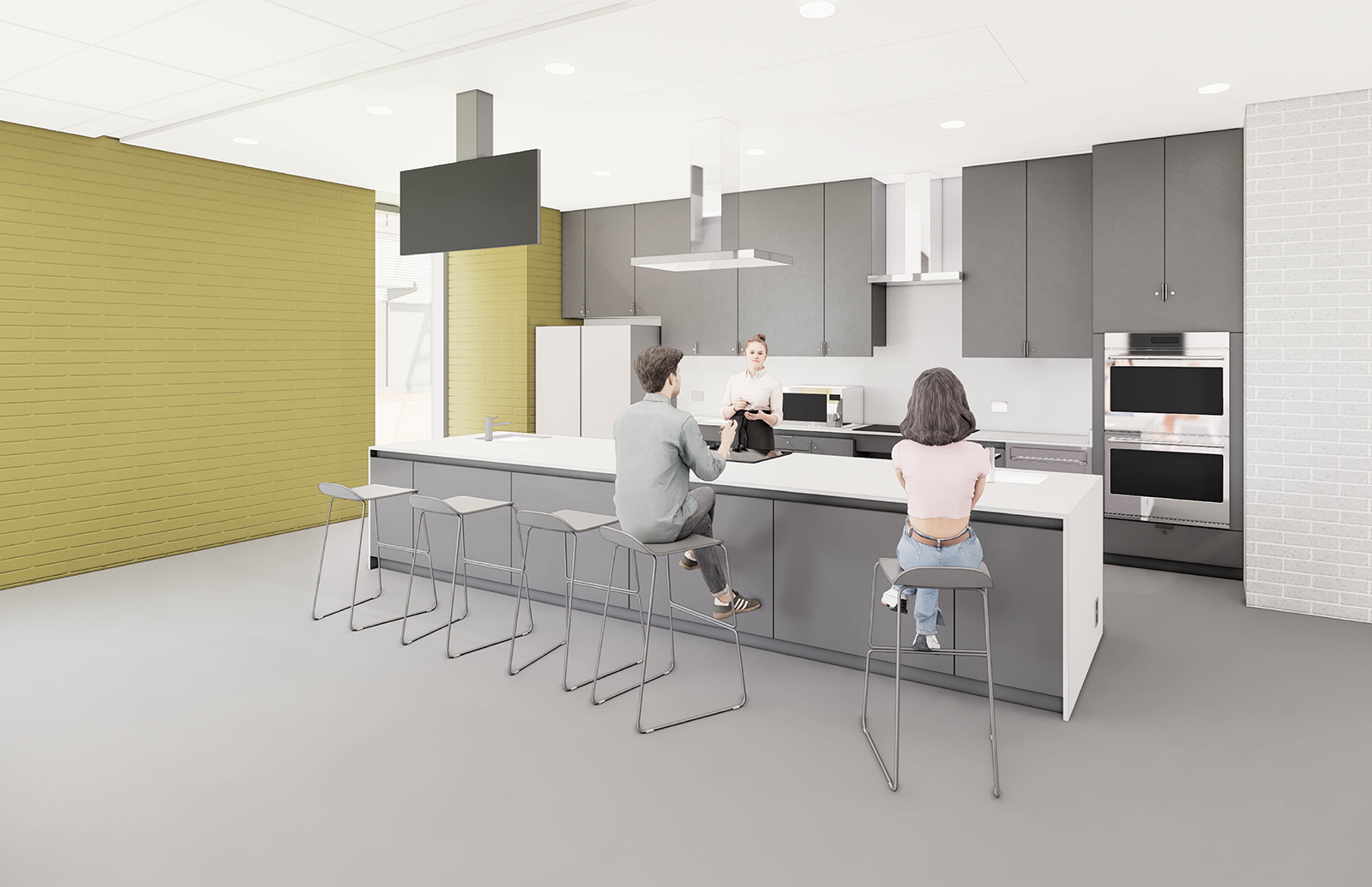 A rendering of the teaching kitchen. On the left wall is a floor to ceiling window. On the back wall are cupboards for storage, a fridge, ovens, stovetop, and exhaust. In front of the back wall is a large kitchen island with a sink and storage. On top of the island is a ceiling-mounted TV to be used when cooking classes are in session, to show students a close-up of the cooking taking place on the kitchen island. Three people are hanging out in the space.