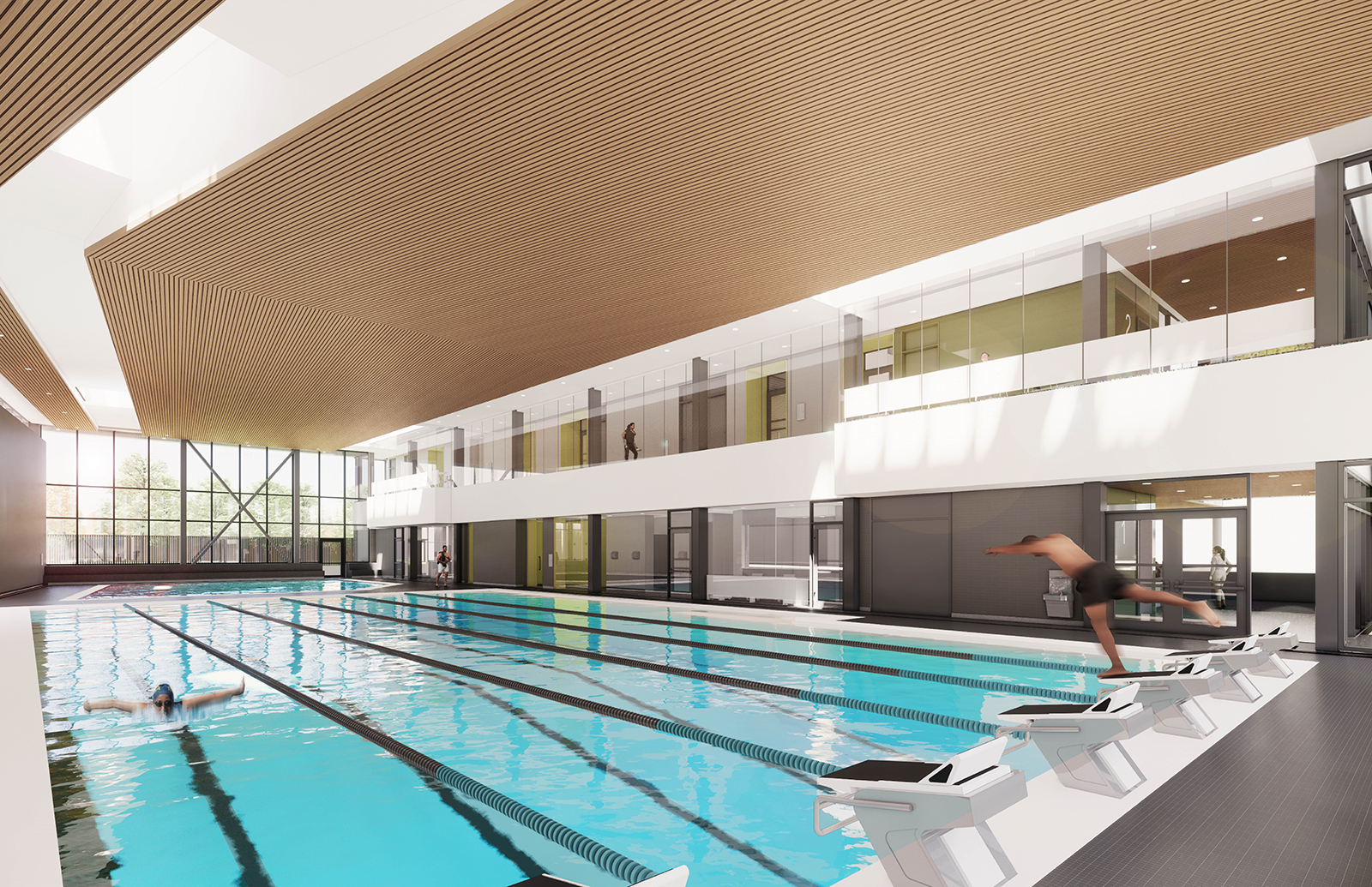 A rendering of the aquatic centre, with the lane pool with diving blocks in the foreground, and leisure pool in the background. The leisure pool has an accessible beach entrance. The lane pool has an accessible ramp entrance and a hoist (not pictured). The roof is slatted wood with natural light coming into the space through the rooftop as well as the north, west, and south walls. There is a grey deck around the pools. There are glass walls along the east wall, with views into the second floor hallway and viewing areas, and the main floor change rooms, showers, and lobby. Not pictured is the leisure pool water-play feature, the lane pool accessible hoist, and lifeguard stations. People are actively using the pool space in this image.