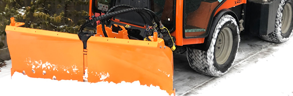 Truck snowplowing a street