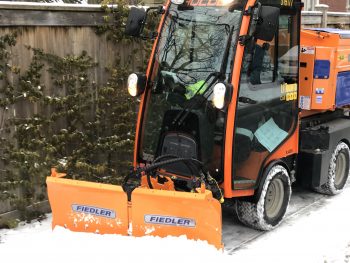 Orange sidewalk plow