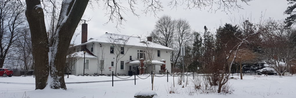 Cedar Ridge Creative Centre and grounds in winter covered in snow