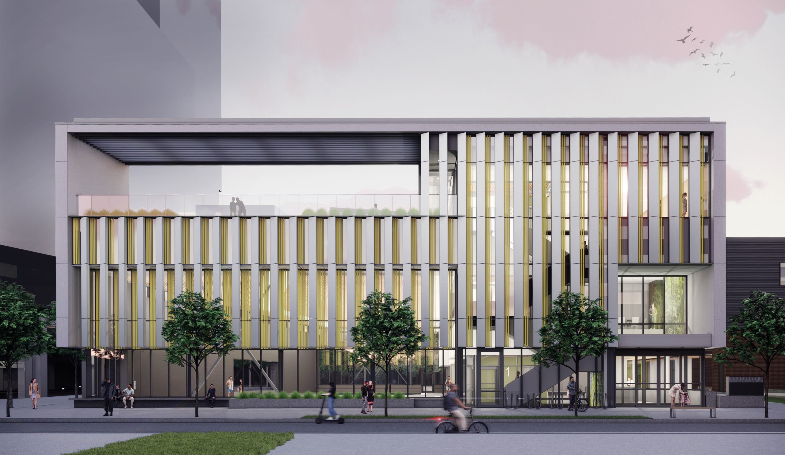 A rendering of the front of the building, looking north from the south side of Davisville Ave. The building is three storeys tall. The main floor façade is glass, and in front of the building are benches, planters, trees and bike parking. The entrance is on the right (east) end. The second and third floor façade include vertical metal louvres and glass, there is a light green colouring through the façade. The third floor is an accessible rooftop on the left(west) side with a pergola. The right (east) side is a continuation of the façade.