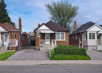 residential single family homes on a quiet street in the summer