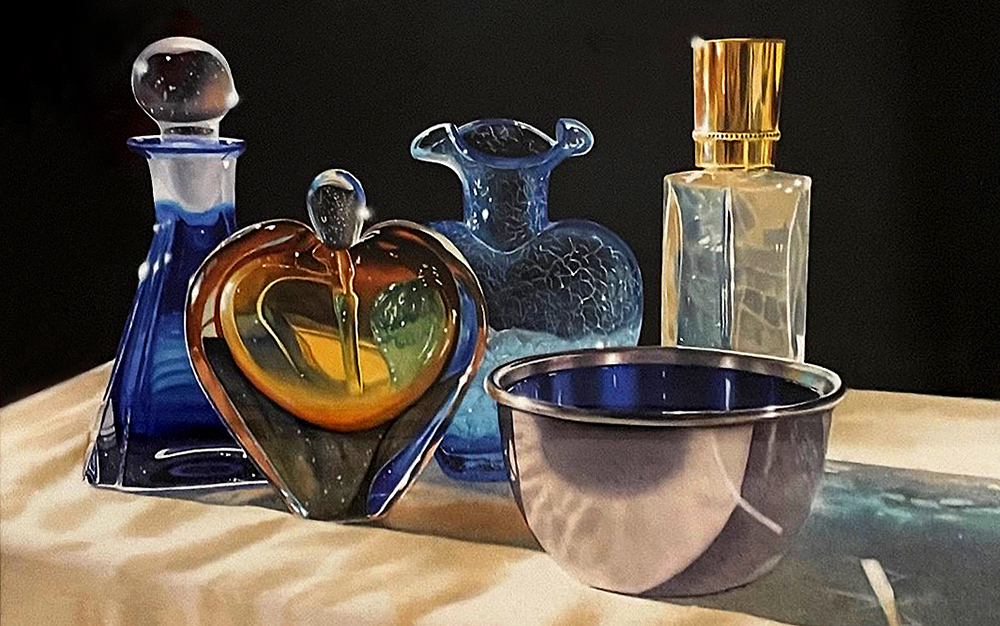 Photograph of blue and orange glass vases beside a purple ceramic bowl