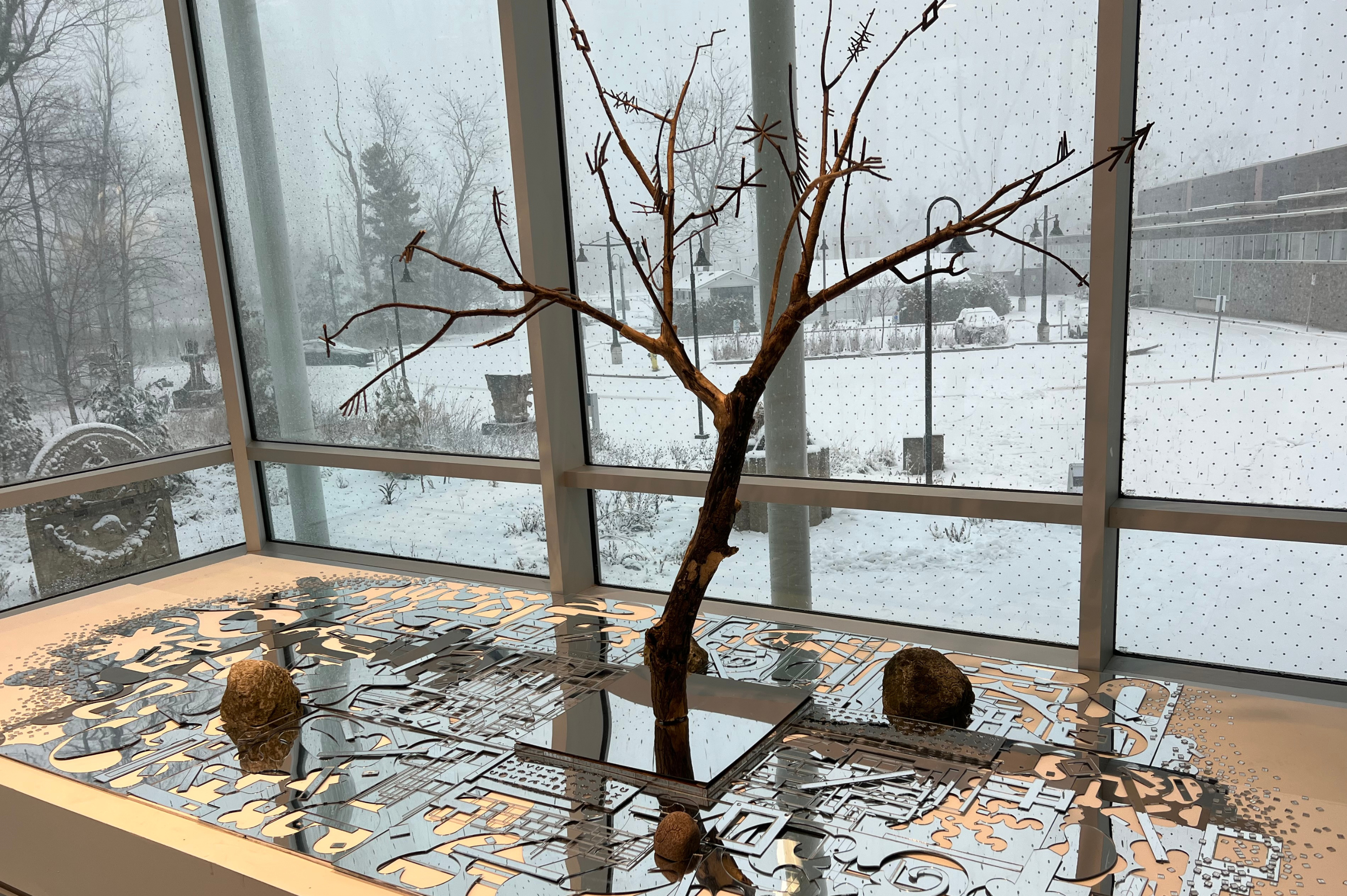 Metal sculpture on a table in a building lobby