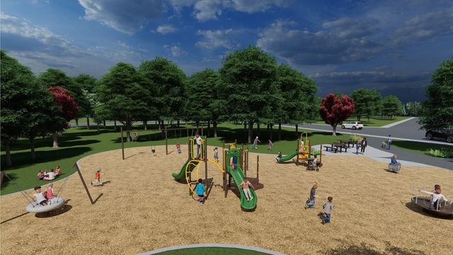 A rendering of playground Design B for the Eden Valley Park Playground improvements, looking to the south from the north. From the lower-left to the upper-right, it includes a group swing, a swing set, senior play equipment, junior play equipment, picnic tables and a group spinner toy. 