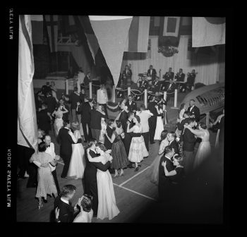 Photograph depicts couples ballroom dancing