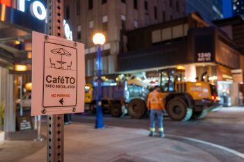No parking sign ahead of CafeTO curb lane cafe installation.