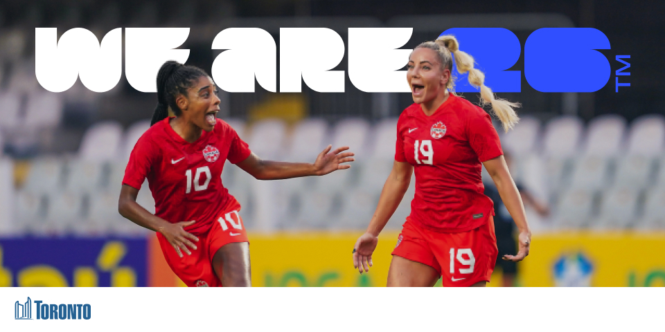 Two players excitedly running with We Are 26 logo
