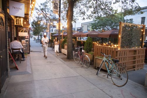 Exterior view of a curblane patio decorated with white lights