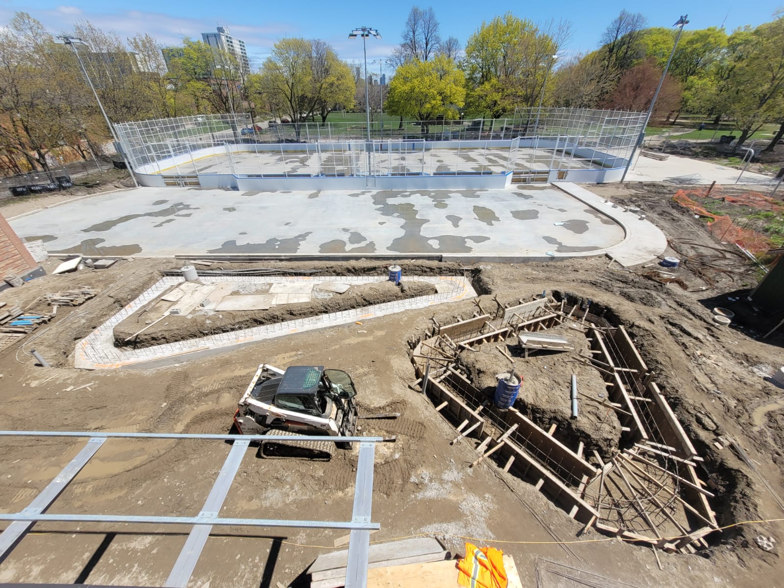 Photo taken from roof of Clubhouse looking down into area where new public plaza will exist. The foundations for two large triangular planters have been excavated.