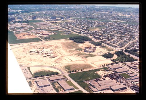 Image depicts oblique aerial view of construction site