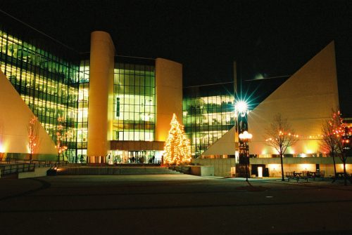 Image depicts exterior of Scarborough Civic Centre at night, with illuminated Christmas Tree