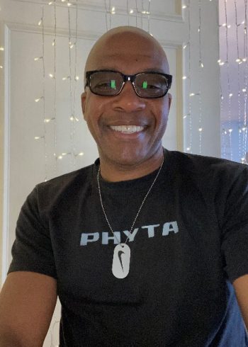 Mark Poyser, wearing a dark shirt, smiling.