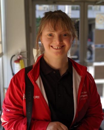 Tatem Morrison in a road jacket, smiling.