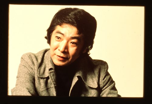 Image depicts head and shoulders portrait of Raymond Moriyama