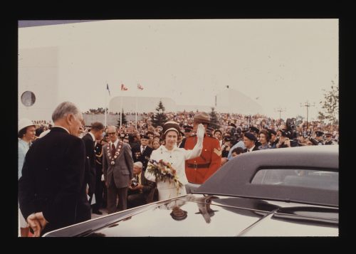 Image depicts Queen Elizabeth II, with Mayor Cosgrove in background