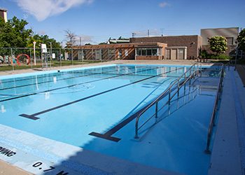 McGregor swimming pool. Daytime. Filled with water. No swimmers.