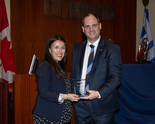 Joanna Duarte Laudon and Paul Johnson holding City Manager's Award