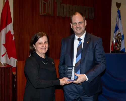 Vera Dodic, Director, Strategic Partnerships and City Manager Paul Johnson holding City Manager's Award