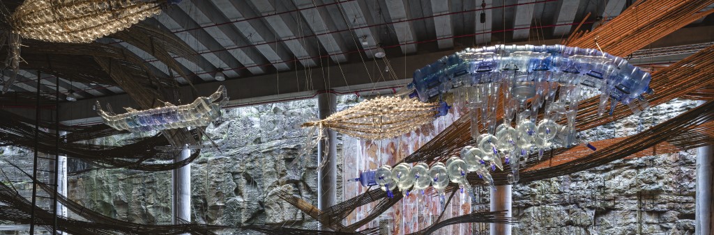 Glass and bamboo artwork suspended from ceiling