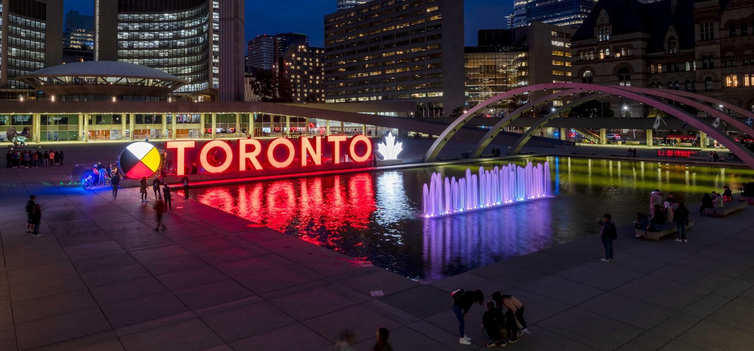 Toronto sign at Nathan Phillips Square lit orange for National Day for Truth and Reconciliation