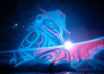 Blue Indigenous-style art projection.