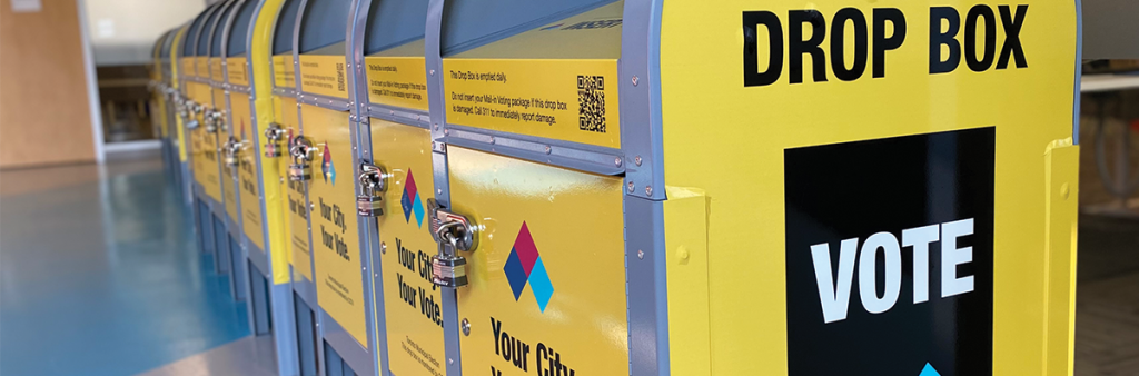 A row of multiple Toronto Elections Yellow Mail-in Voting Drop Boxes