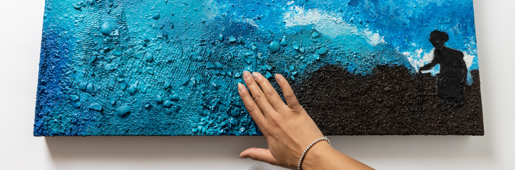 Textured painting being touched by outstretched hand