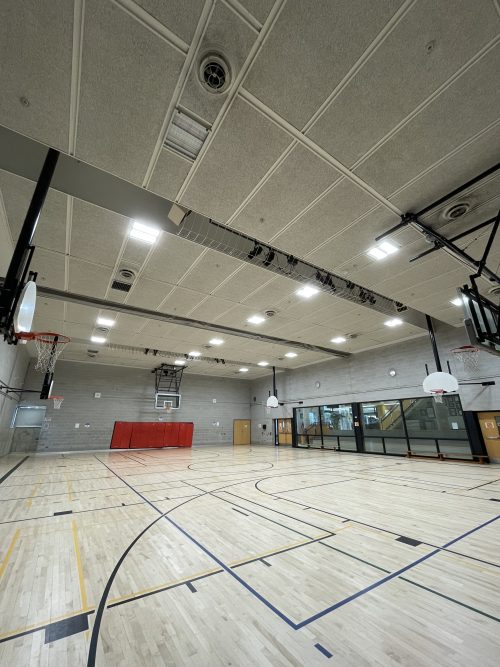 LED lighting in a gymnasium in the Waterfront Building showing a basketball court.