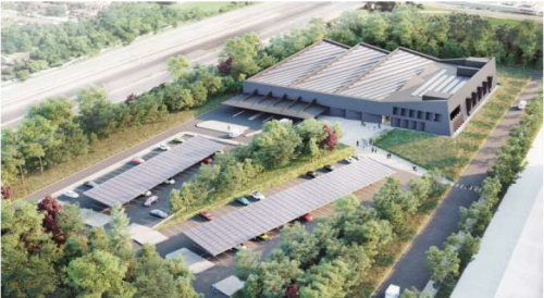 Aerial view of multi functional EMS station showing building and parking lot.