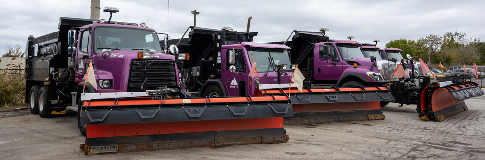 Snowplows ready for work at a City holding yard