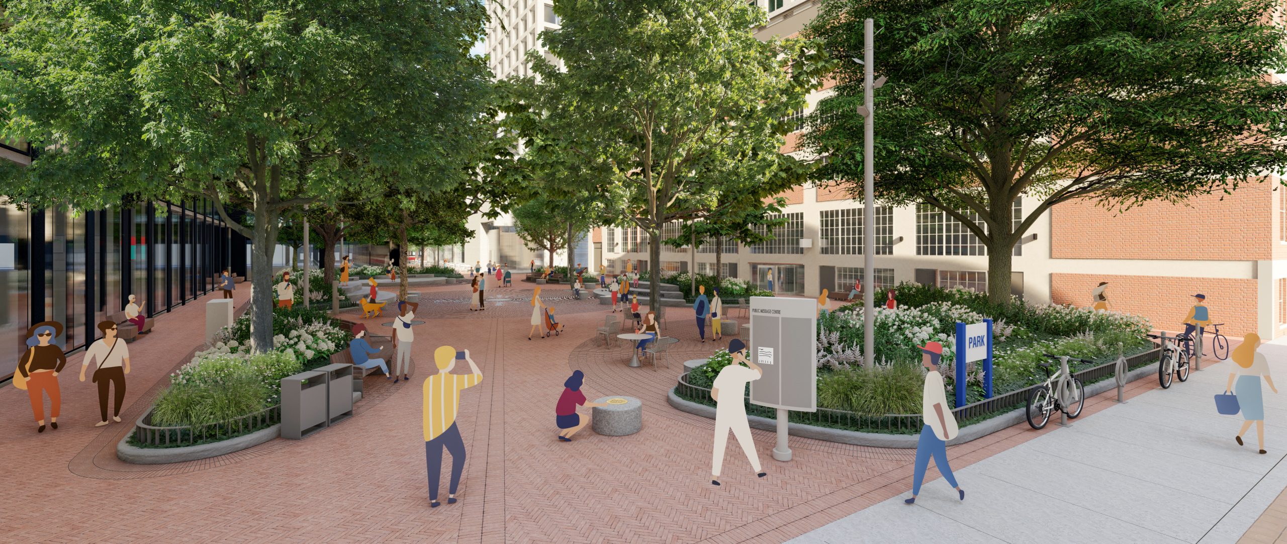 A view looking north into the park from Richmond Street East. The entrance to the park features a band of pavers aligned with “true north”, leading into a large central gathering space. The entrance is framed by a large, mounded planting bed along the Richmond Street East sidewalk, and a smaller planting bed running parallel to the face of the building that frames the park. Bicycle parking is located along the Richmond Street East sidewalk beside the large planting bed. The large mounded planting bed along Richmond Street East includes lush low plantings, a large tree, a light post, and a park sign. A community message board is located adjacent to the large planting bed following the entrance into the park. 