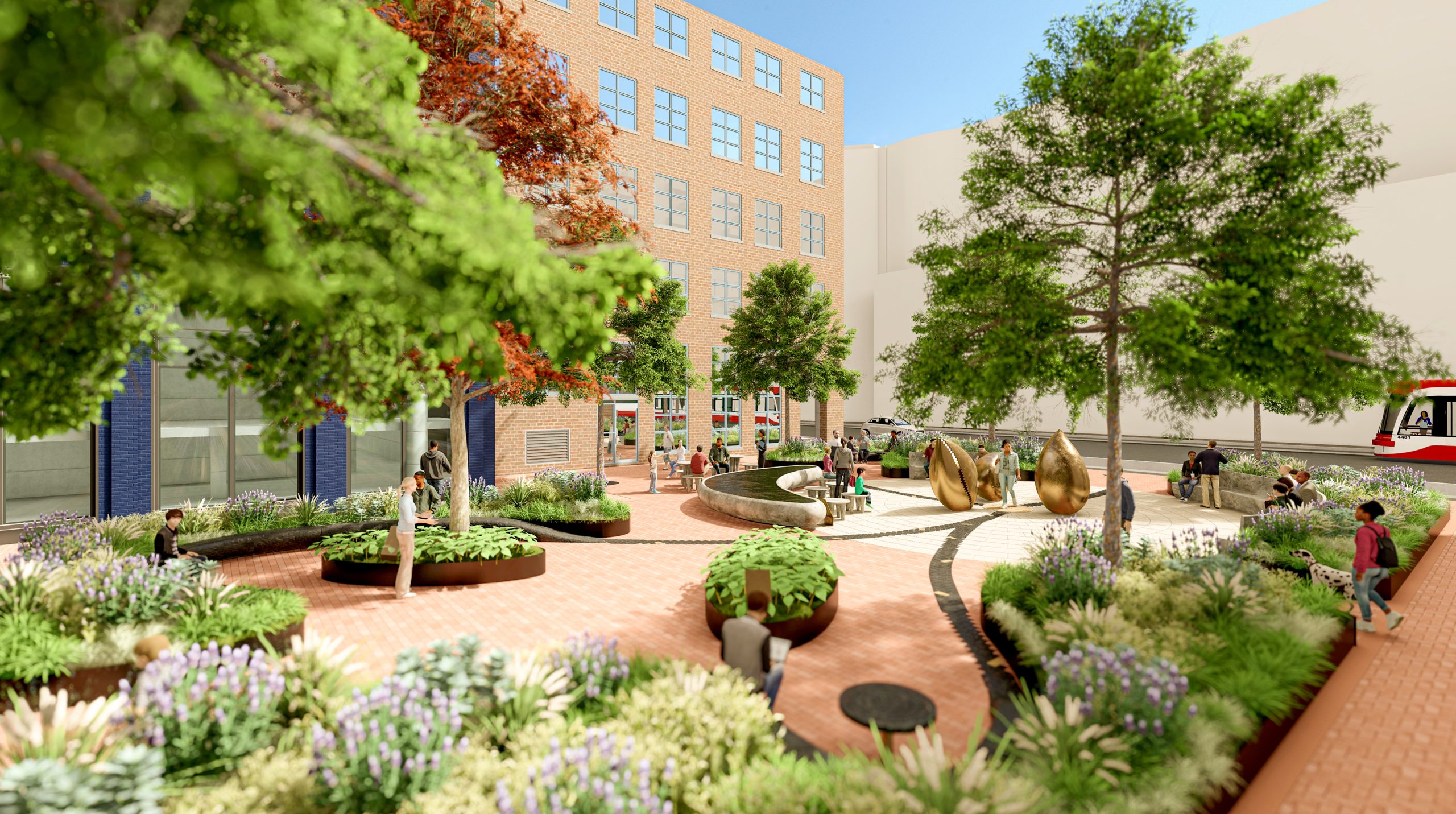 A view from the Northwest edge of the park facing Southeast. The braided path splits from the central medallion and forms two elliptical shaped seating areas. These are more intimate spaces surrounded by planting and designed to act as a destination where each braided path ends. There is bench seating that defines the space and continues the form of the braided path. There is a small elliptical planting bed in front of the Caribbean seating area with a plaque that provides information on migration from that area. The central gathering space, water feature and Cowrie shells can be seen beyond surrounded by planting against the heritage building to the East.