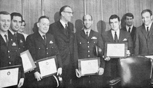 Group portrait of TTC employees receiving awards.
