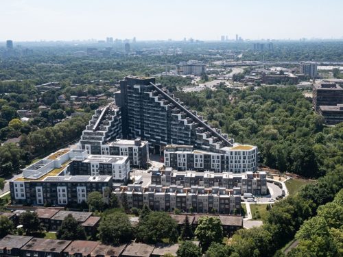 Aerial photo of 25 Adra Grado Way – Scala Residences Inc., a brown and white residential condominium building surrounded by trees nestled in the Bayview Village neighbourhood.