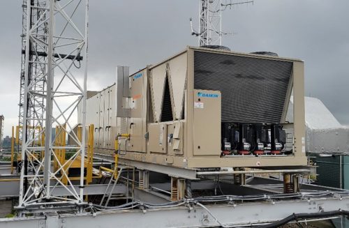 Rooftop unit with energy recovery wheel outside EMS HQ.