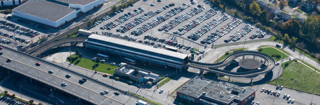 Aerial view of the Kennedy Station Area looking South. It includes Kennedy Station, Eglinton Avenue East over pass, Don Montgomery Community Recreation Centre and nearby parking and residential uses.