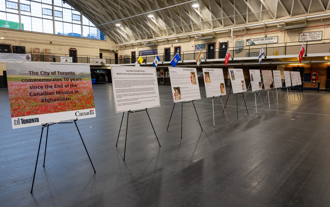 Eleven display panels which tell the story of the Canadian Mission in relation to Toronto are shown on easels in Fort York Armoury