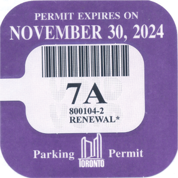 A purple parking permit renewal sticker that reads: Permit Expires on November 30, 2024.