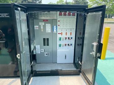 Close up view of power drop box with doors open so the interior is visible