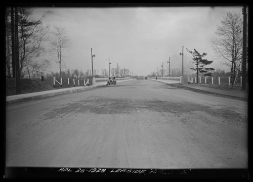 Image depicts monochrome photographs of road approach to bridge