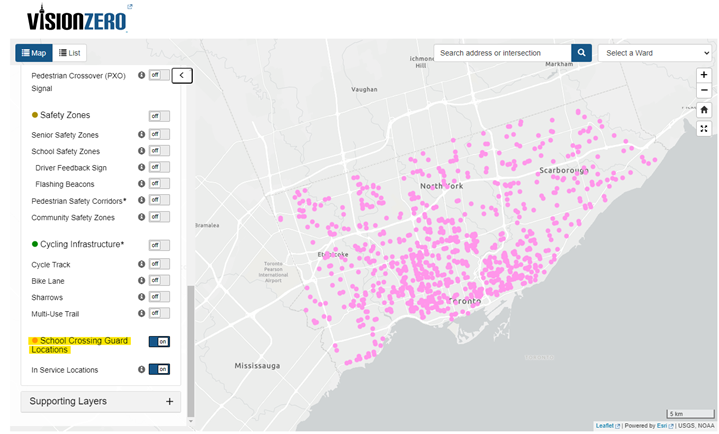 The image shows the Vision Zero Mapping Tool with the School Crossing Guard featured turned on. The image shows pink dots around the city where school crossing guards are currently placed.