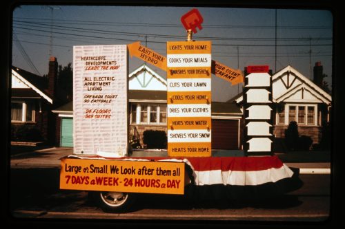 Image depicts colour photograph of parade float promoting the use of electricity