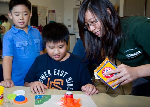 A City staff member is assisting a class with children.